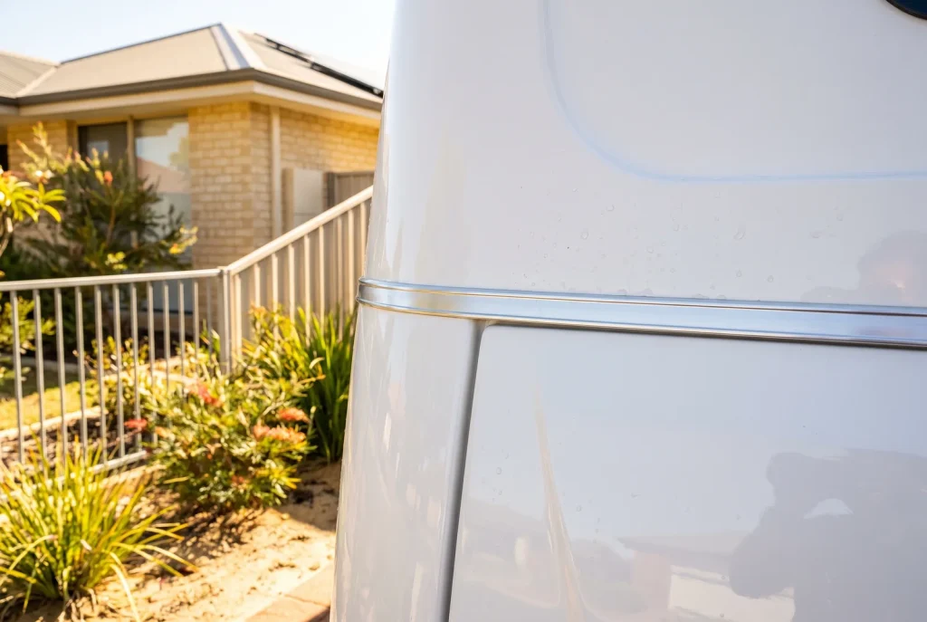 Detailed caravan panel edge and trim transition after professional detailing in O'Connor WA