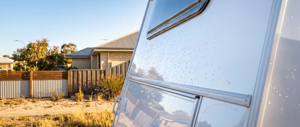 Ceramic coated caravan with glossy mirror finish and water beading, detailed in O'Connor WA