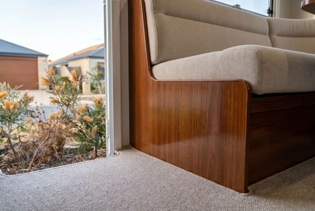 Spotless caravan interior seam and edge detailing result in O'Connor showing clean upholstery and polished timber